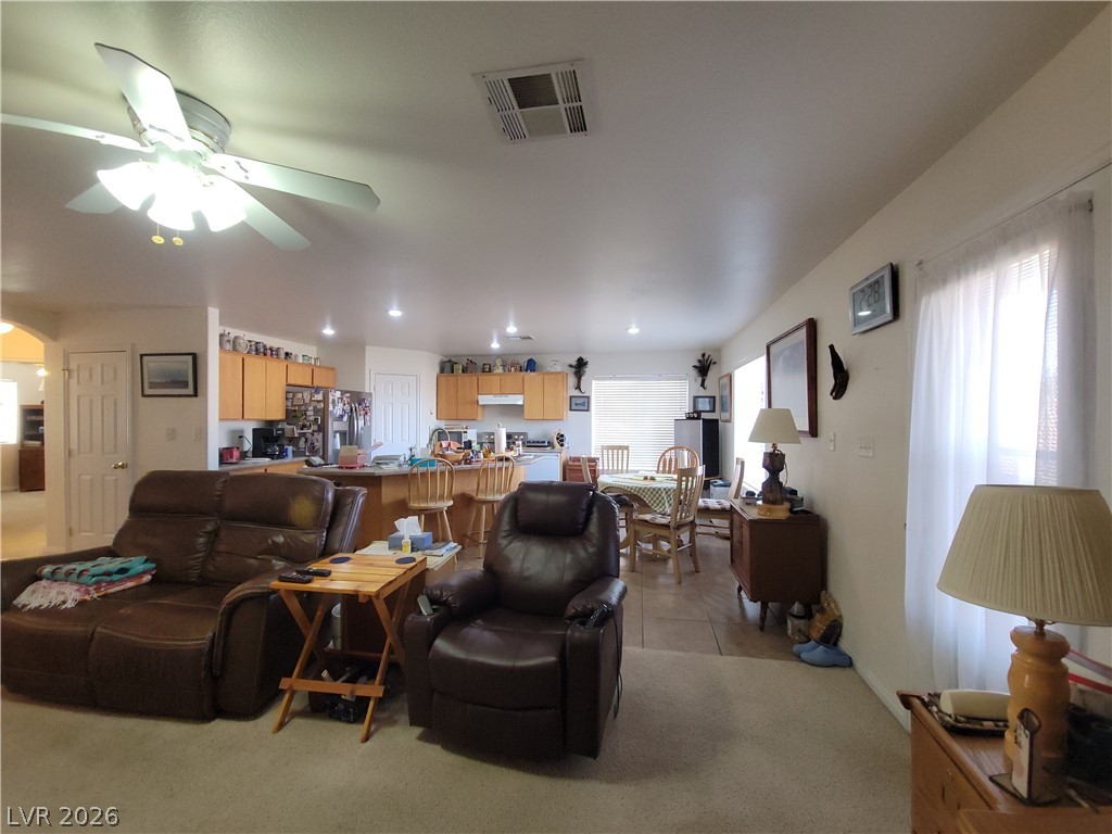 768 Weiser Ridge Street Overton, NV 89040 - Photo 8 of 37 Living area featuring light colored carpet, ceiling fan, and recessed lighting