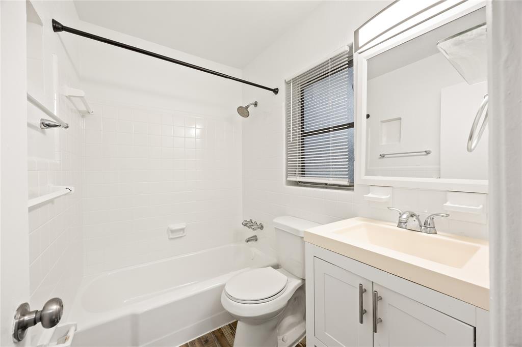 1801 Northeast 56th Street, Unit 5 Fort Lauderdale, FL 33308 - Photo 17 of 22 a bathroom with a sink a toilet and a bathtub