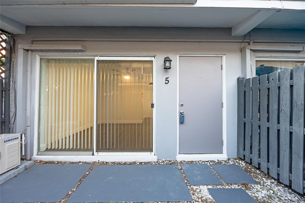 1801 Northeast 56th Street, Unit 5 Fort Lauderdale, FL 33308 - Photo 19 of 22 a view of a door and a window