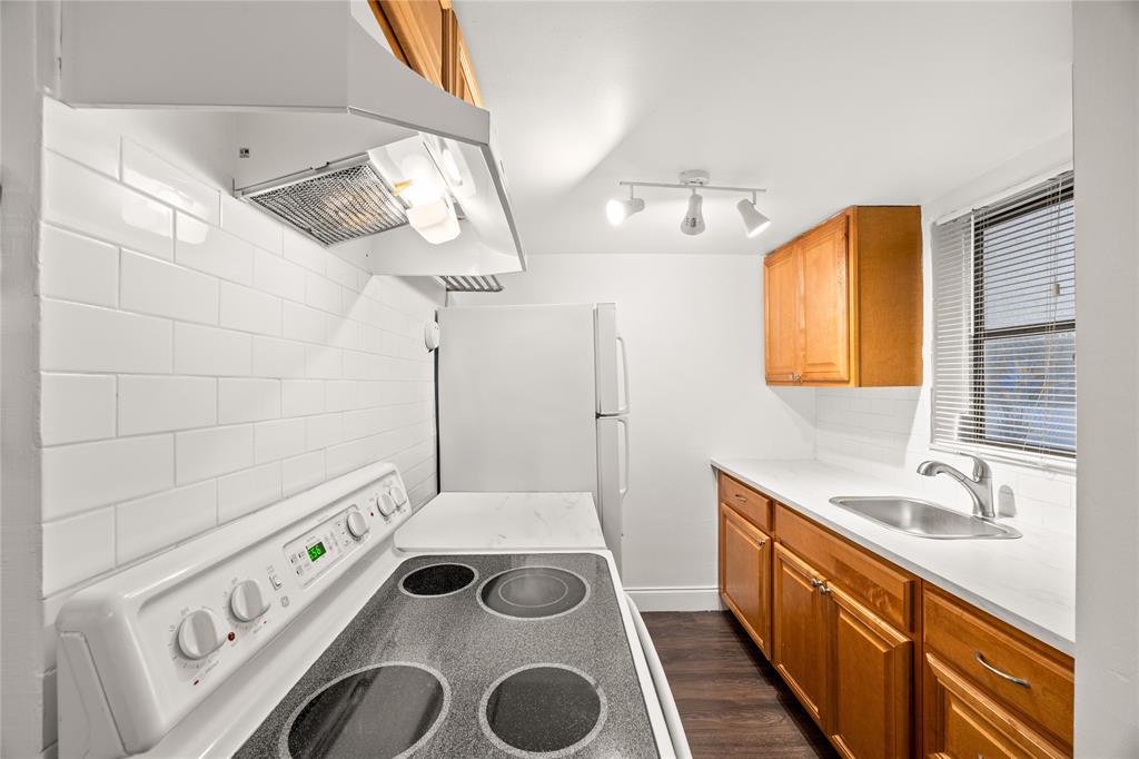 1801 Northeast 56th Street, Unit 5 Fort Lauderdale, FL 33308 - Photo 6 of 22 a bathroom with a sink and a washing machine