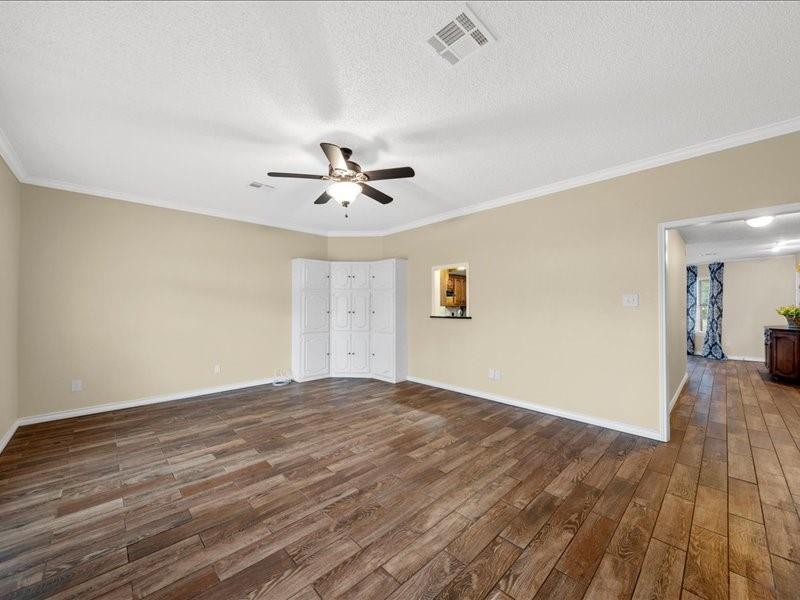 1072 Chapman Road Crawford, TX 76638 - Photo 5 of 39 a view of empty room with wooden floor