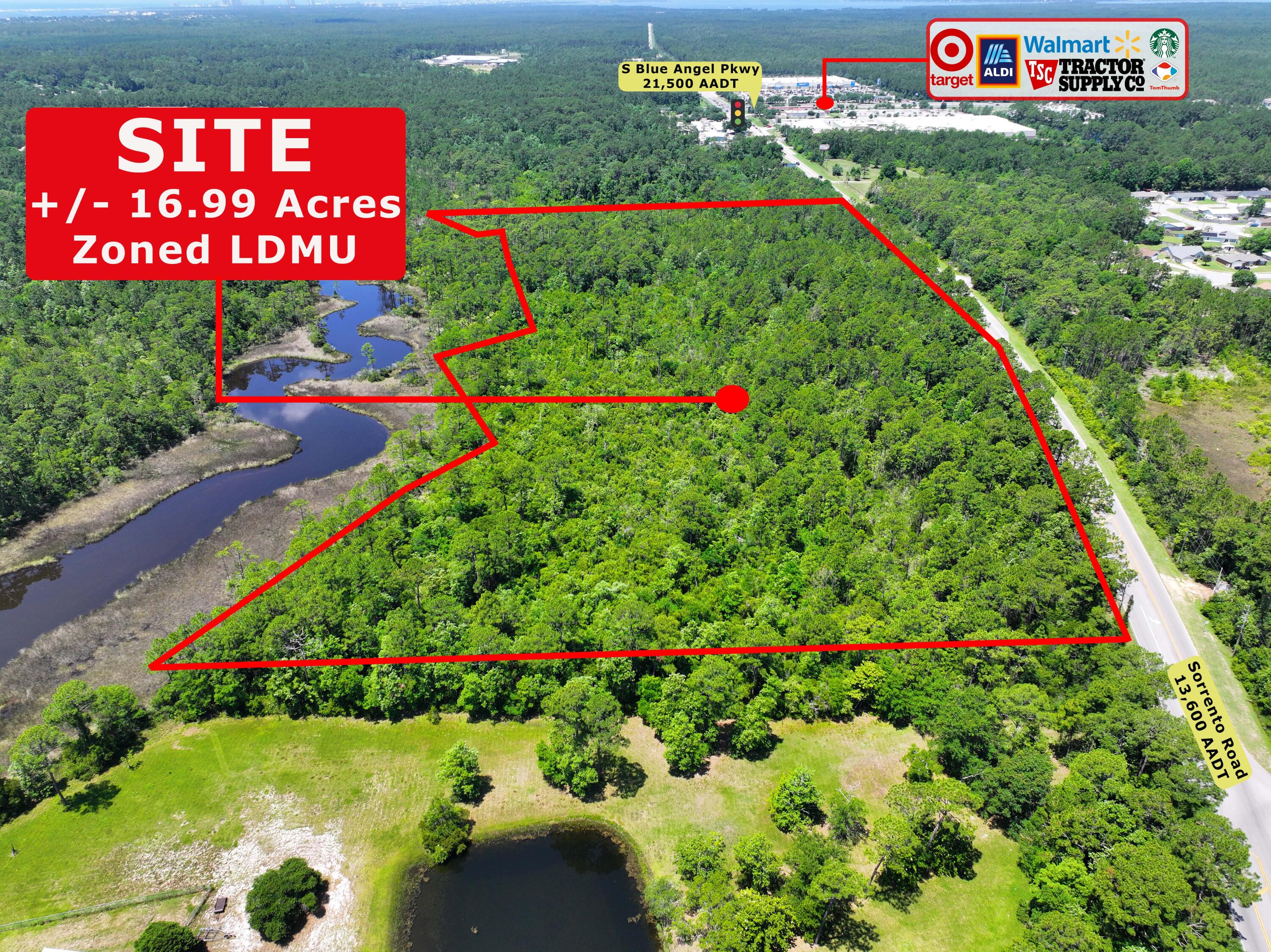 9900 Sorrento Road Pensacola, FL 32506 - Photo 5 of 9 a sign that is sitting in front of flowers