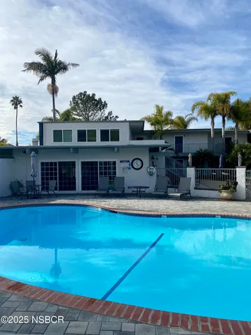a view of a swimming pool with a patio