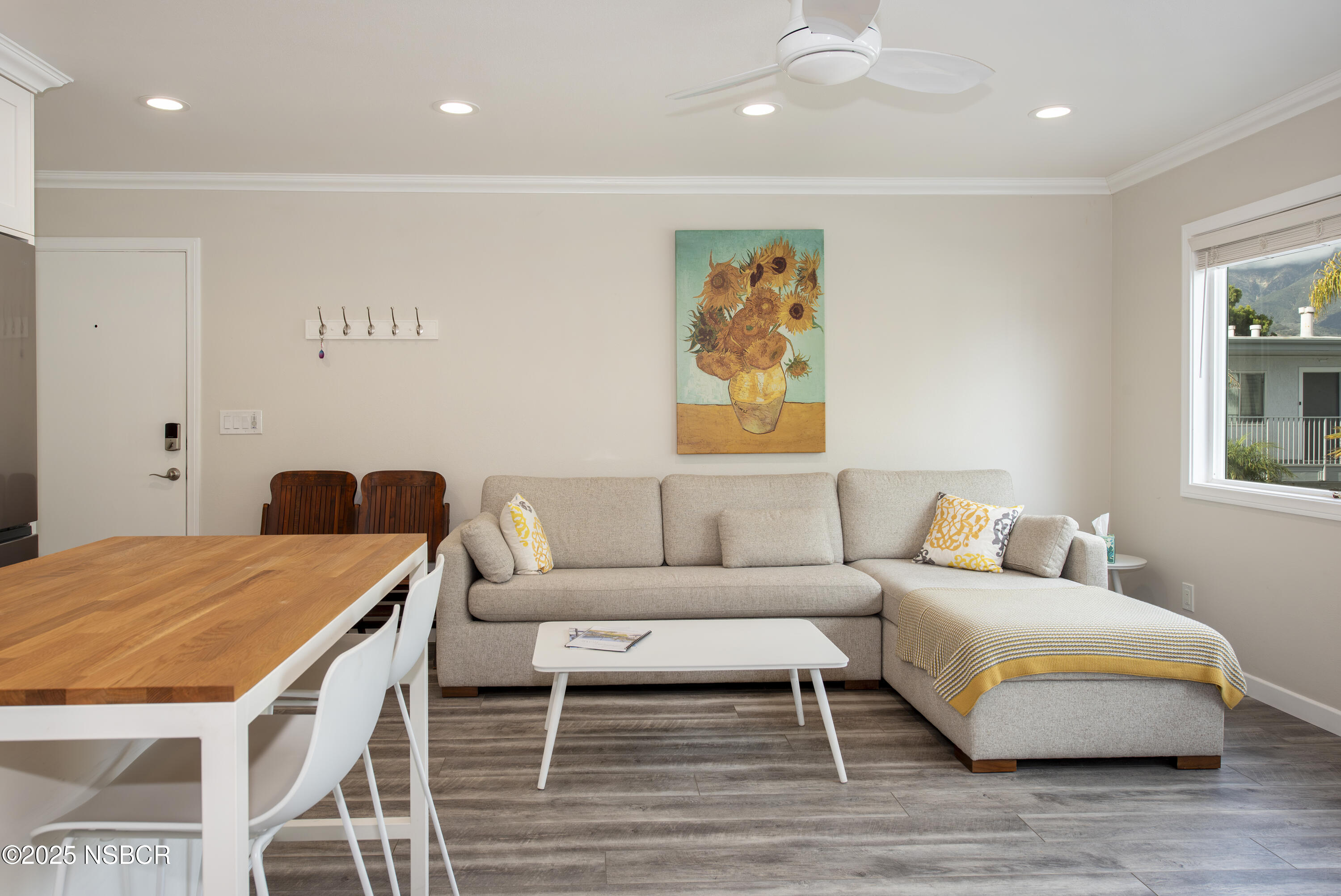 4880 Sandyland Road, Unit 11 Carpinteria, CA 93013 - Photo 3 of 28 a living room with furniture and painting on the wall