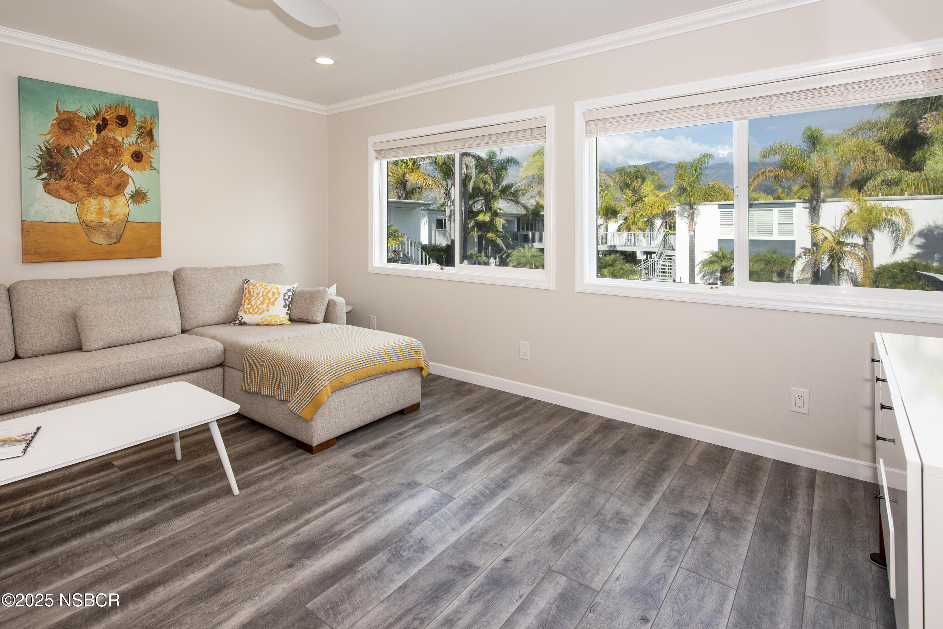 4880 Sandyland Road, Unit 11 Carpinteria, CA 93013 - Photo 4 of 28 a bedroom with a bed and a couch