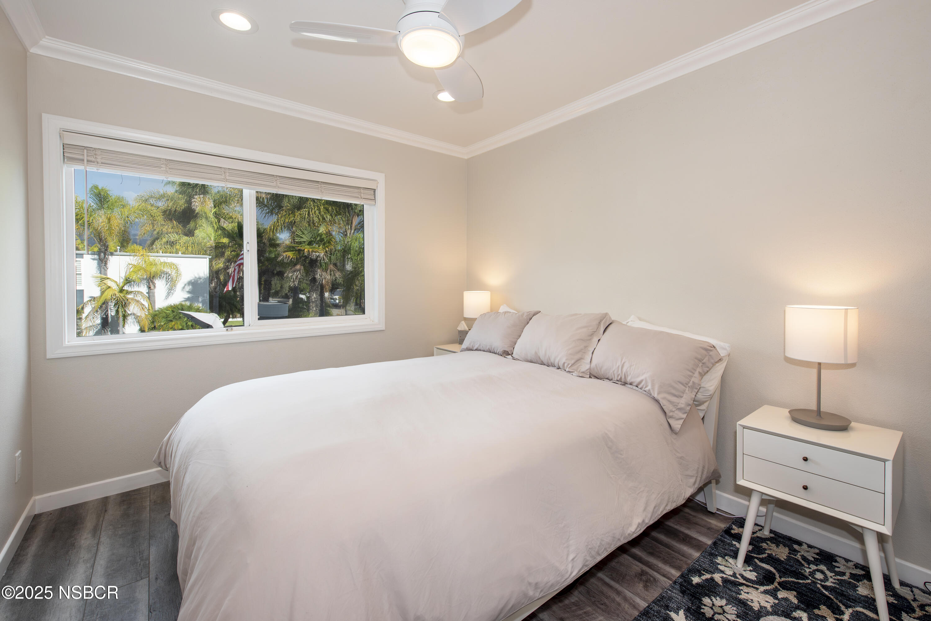4880 Sandyland Road, Unit 11 Carpinteria, CA 93013 - Photo 8 of 28 a large bed sitting in a bedroom next to a window