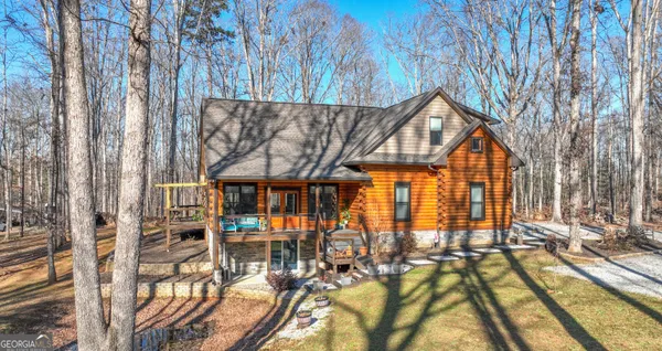 a view of swimming pool with seating area