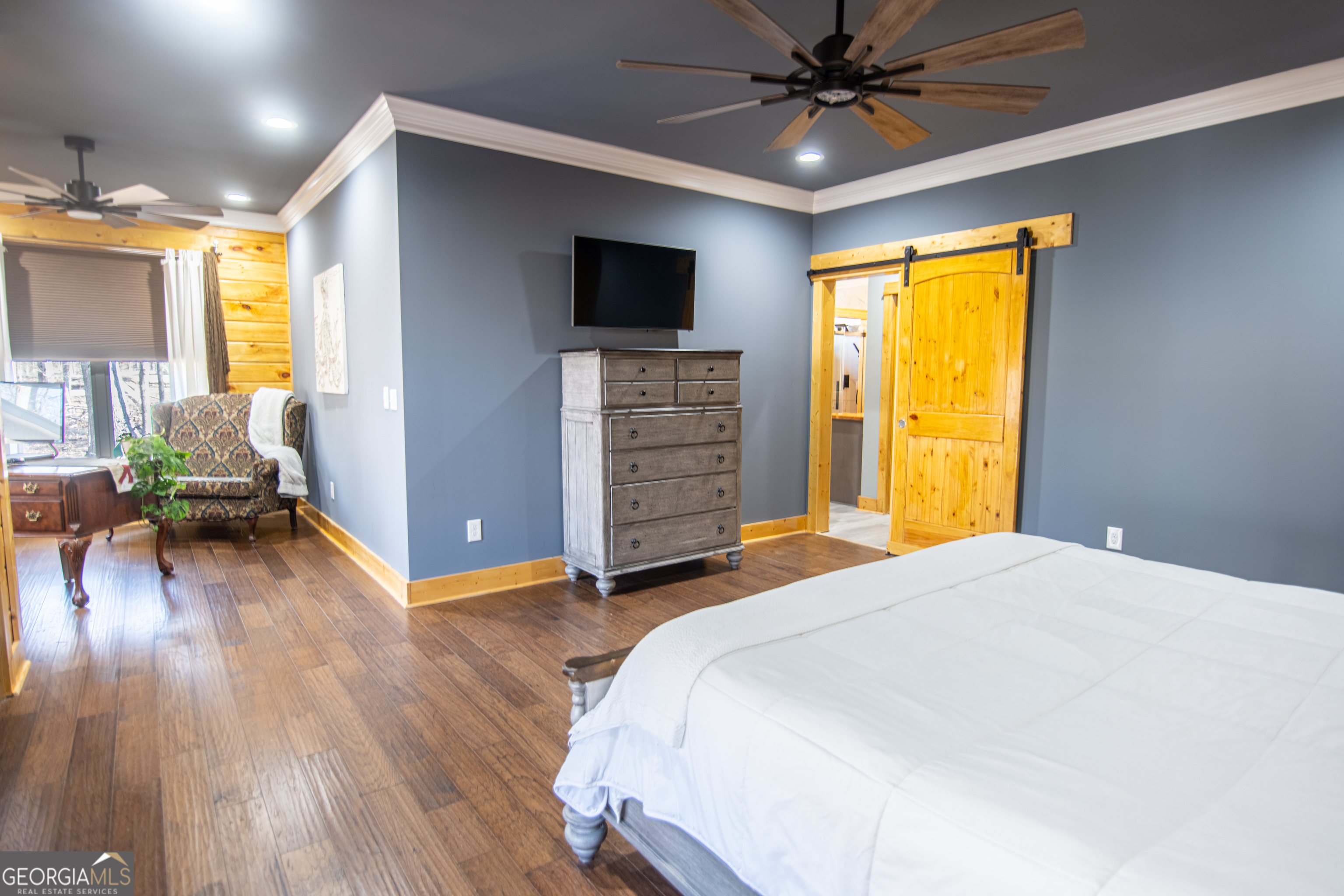 203 Teasley Lane Hartwell, GA 30643 - Photo 16 of 32 a bedroom with a bed and a flat tv screen