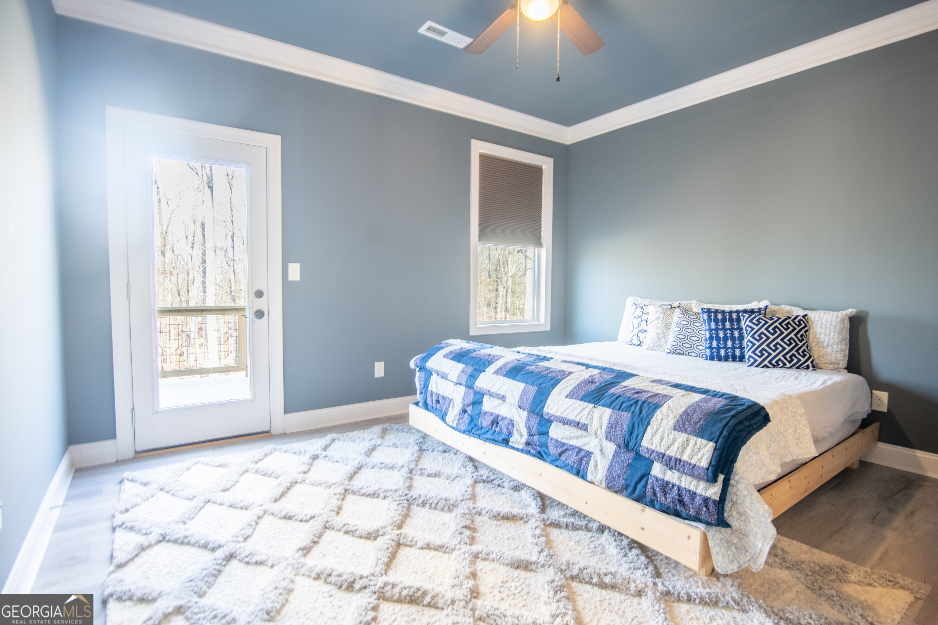 203 Teasley Lane Hartwell, GA 30643 - Photo 19 of 32 a bedroom with a large bed and a window