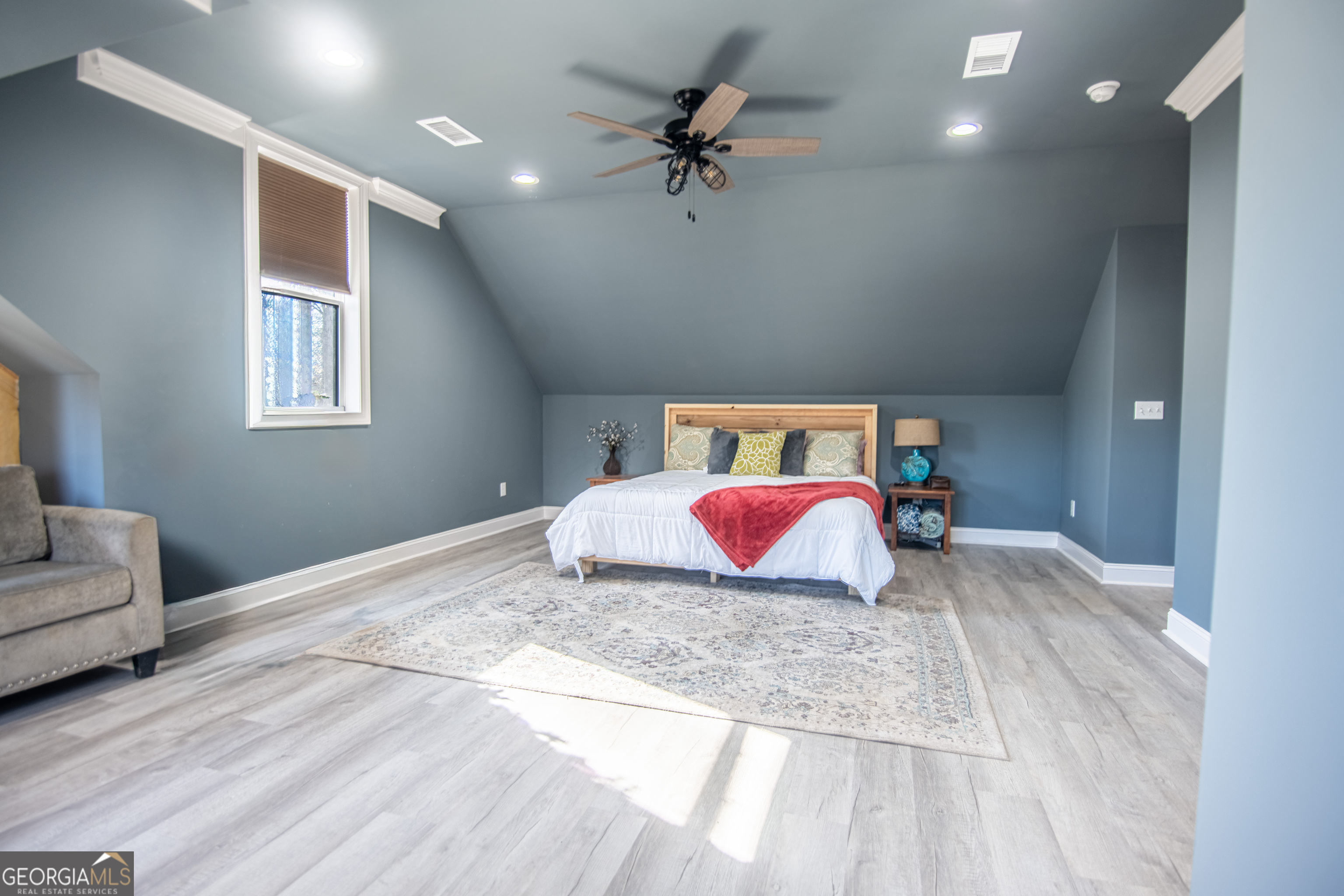 203 Teasley Lane Hartwell, GA 30643 - Photo 22 of 32 a bedroom with a bed and a couch