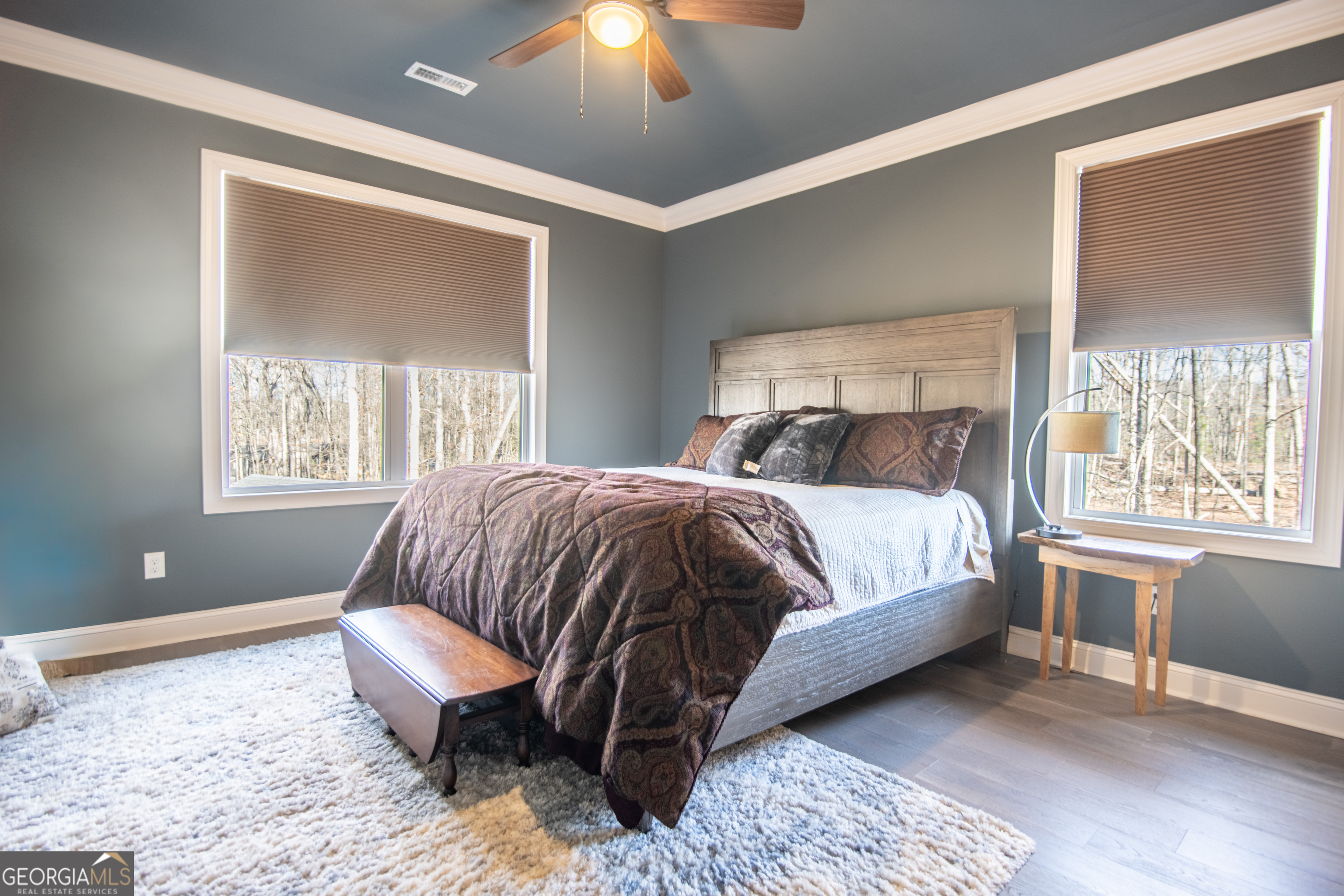 203 Teasley Lane Hartwell, GA 30643 - Photo 24 of 32 a spacious bedroom with a bed and wooden floor