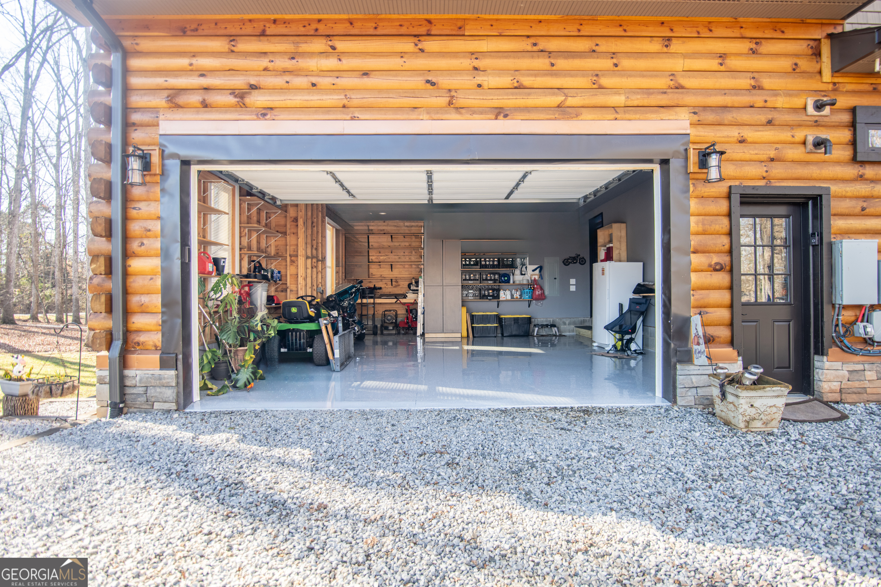 203 Teasley Lane Hartwell, GA 30643 - Photo 29 of 32 a view of a porch with a table and chairs and potted plants