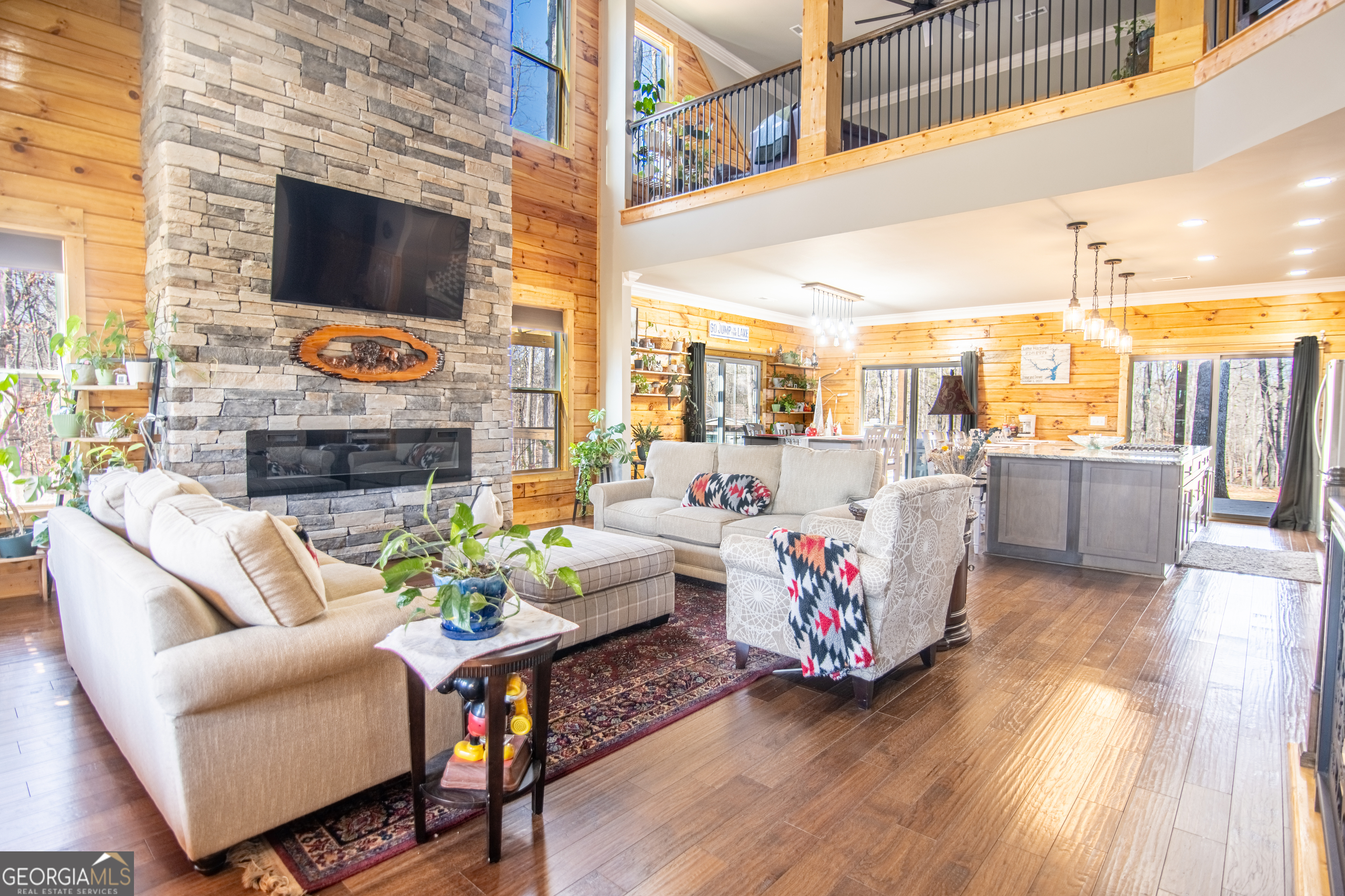 203 Teasley Lane Hartwell, GA 30643 - Photo 10 of 32 a living room with fireplace furniture and a flat screen tv