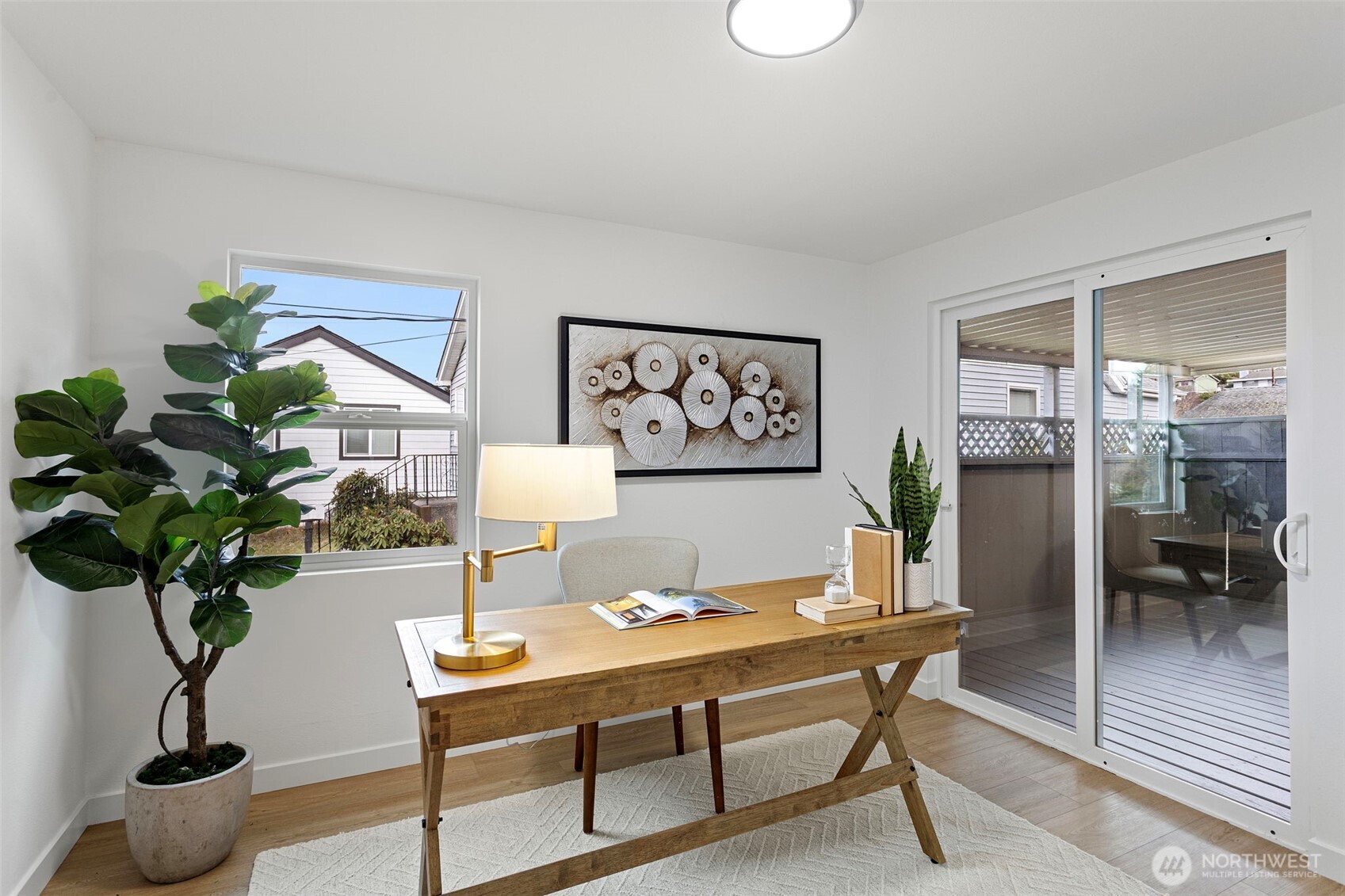 8608 16th Avenue Southwest Seattle, WA 98106 - Photo 11 of 26 a living room with furniture potted plant and glass door