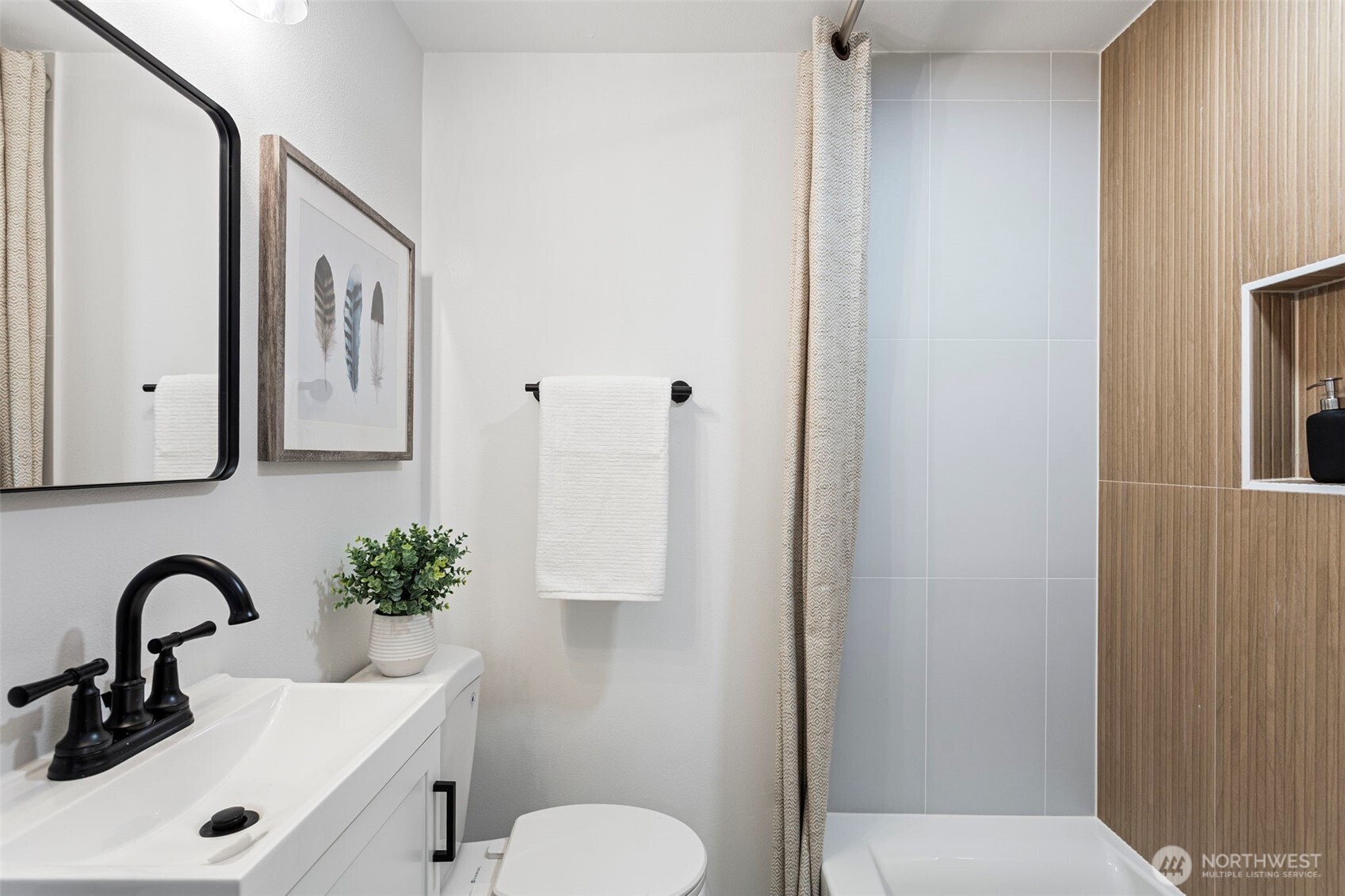 8608 16th Avenue Southwest Seattle, WA 98106 - Photo 12 of 26 a bathroom with a sink and a toilet