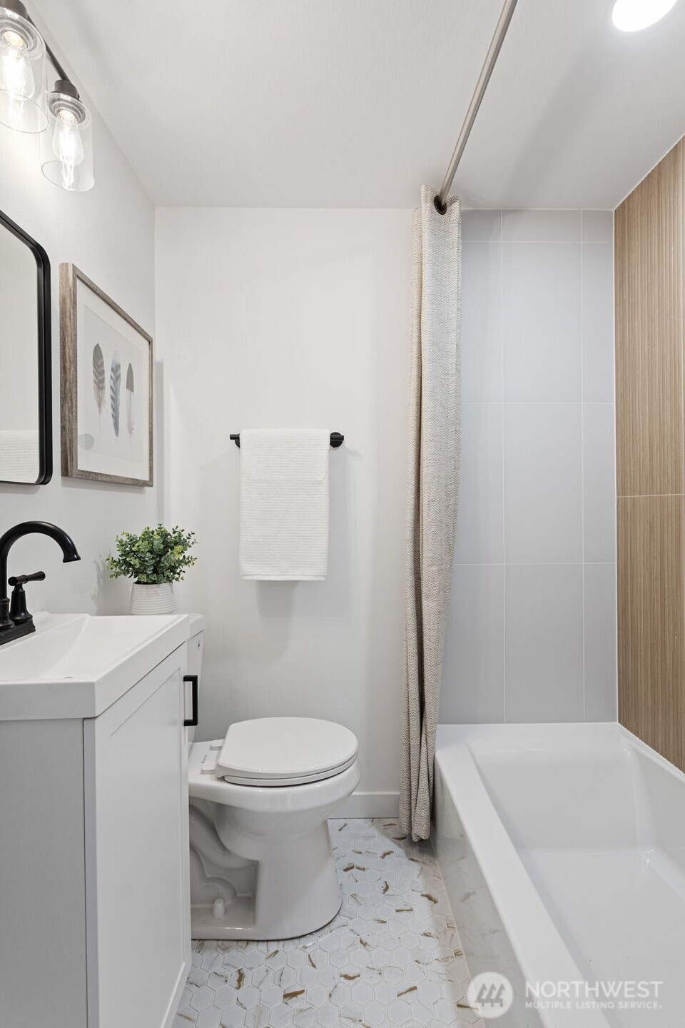 8608 16th Avenue Southwest Seattle, WA 98106 - Photo 13 of 26 a bathroom with a sink a toilet and a bathtub