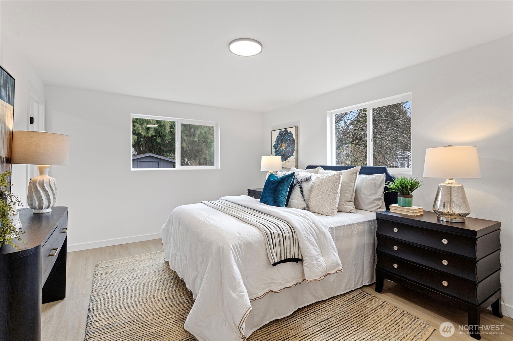 8608 16th Avenue Southwest Seattle, WA 98106 - Photo 15 of 26 a bedroom with a bed and a night stand