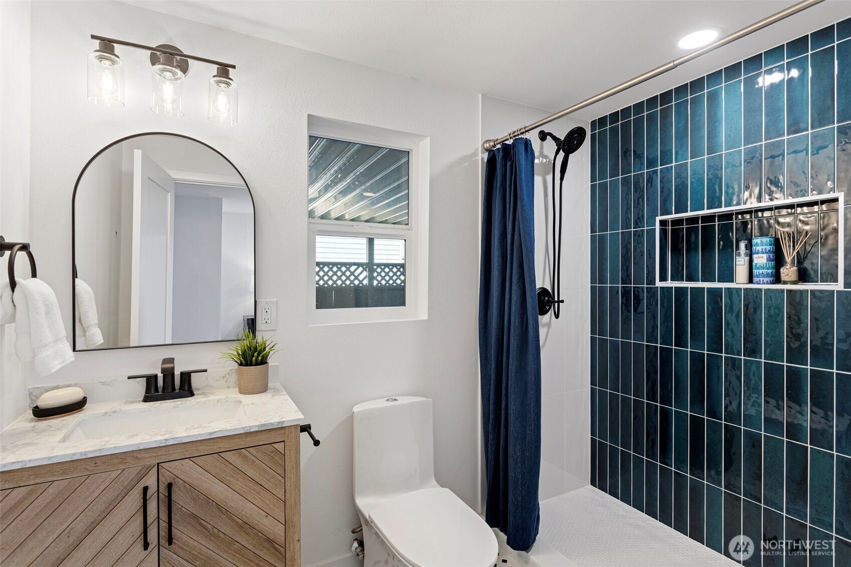 8608 16th Avenue Southwest Seattle, WA 98106 - Photo 17 of 26 a bathroom with a sink toilet and shower