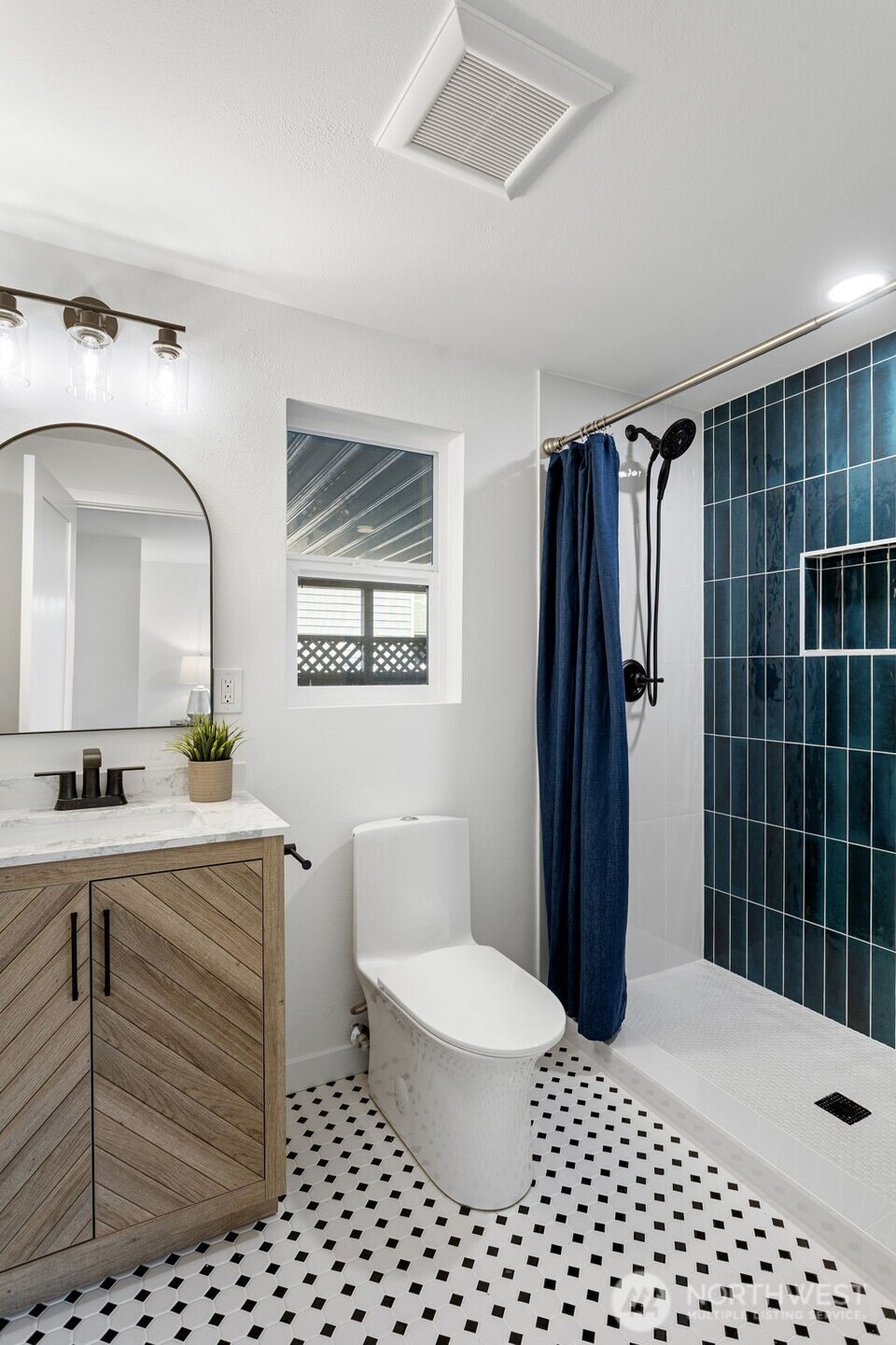 8608 16th Avenue Southwest Seattle, WA 98106 - Photo 18 of 26 a bathroom with a sink toilet and shower