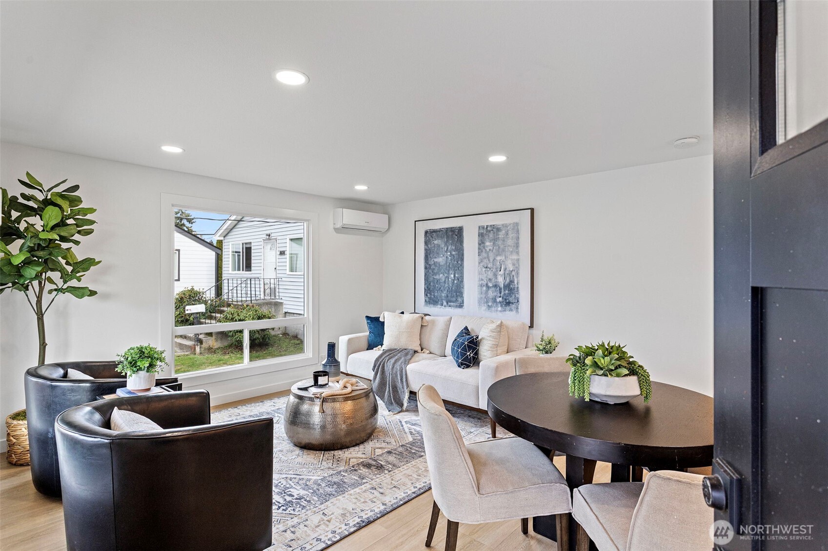 8608 16th Avenue Southwest Seattle, WA 98106 - Photo 2 of 26 a view of a dining room with furniture window and outside view