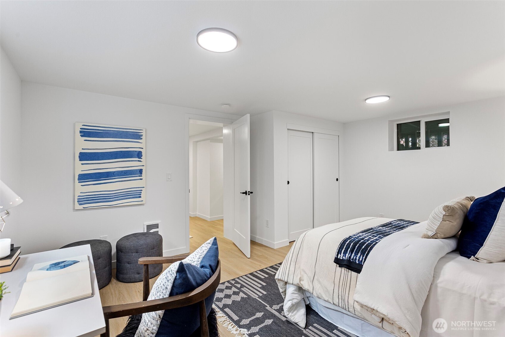 8608 16th Avenue Southwest Seattle, WA 98106 - Photo 21 of 26 a bedroom with a bed and a chair