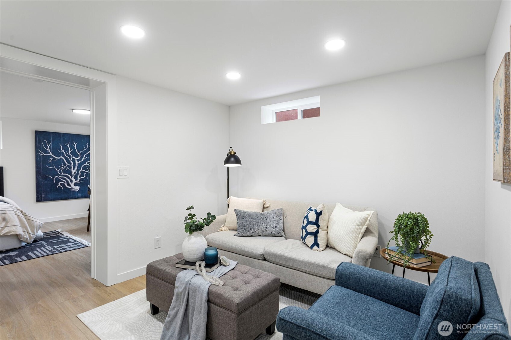 8608 16th Avenue Southwest Seattle, WA 98106 - Photo 23 of 26 a living room with furniture and a potted plant