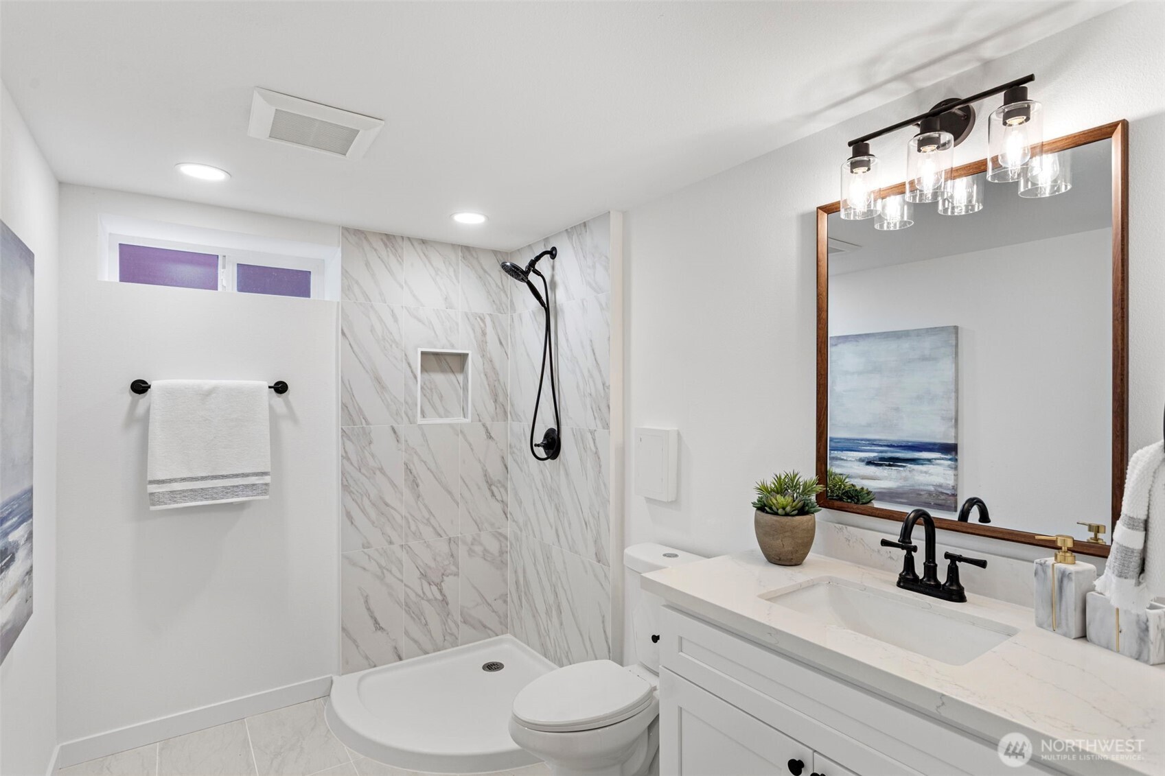 8608 16th Avenue Southwest Seattle, WA 98106 - Photo 24 of 26 a bathroom with a sink a toilet and shower