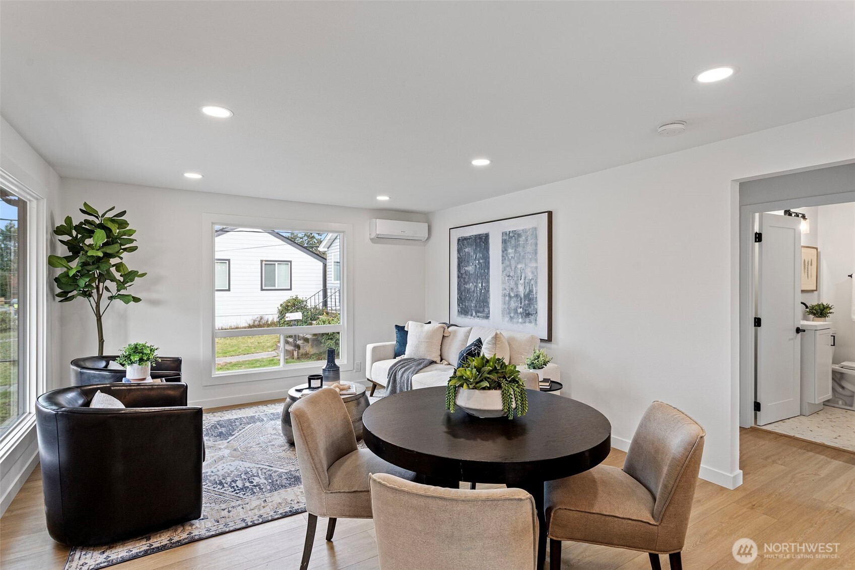 8608 16th Avenue Southwest Seattle, WA 98106 - Photo 5 of 26 a living room with furniture potted plant and a window