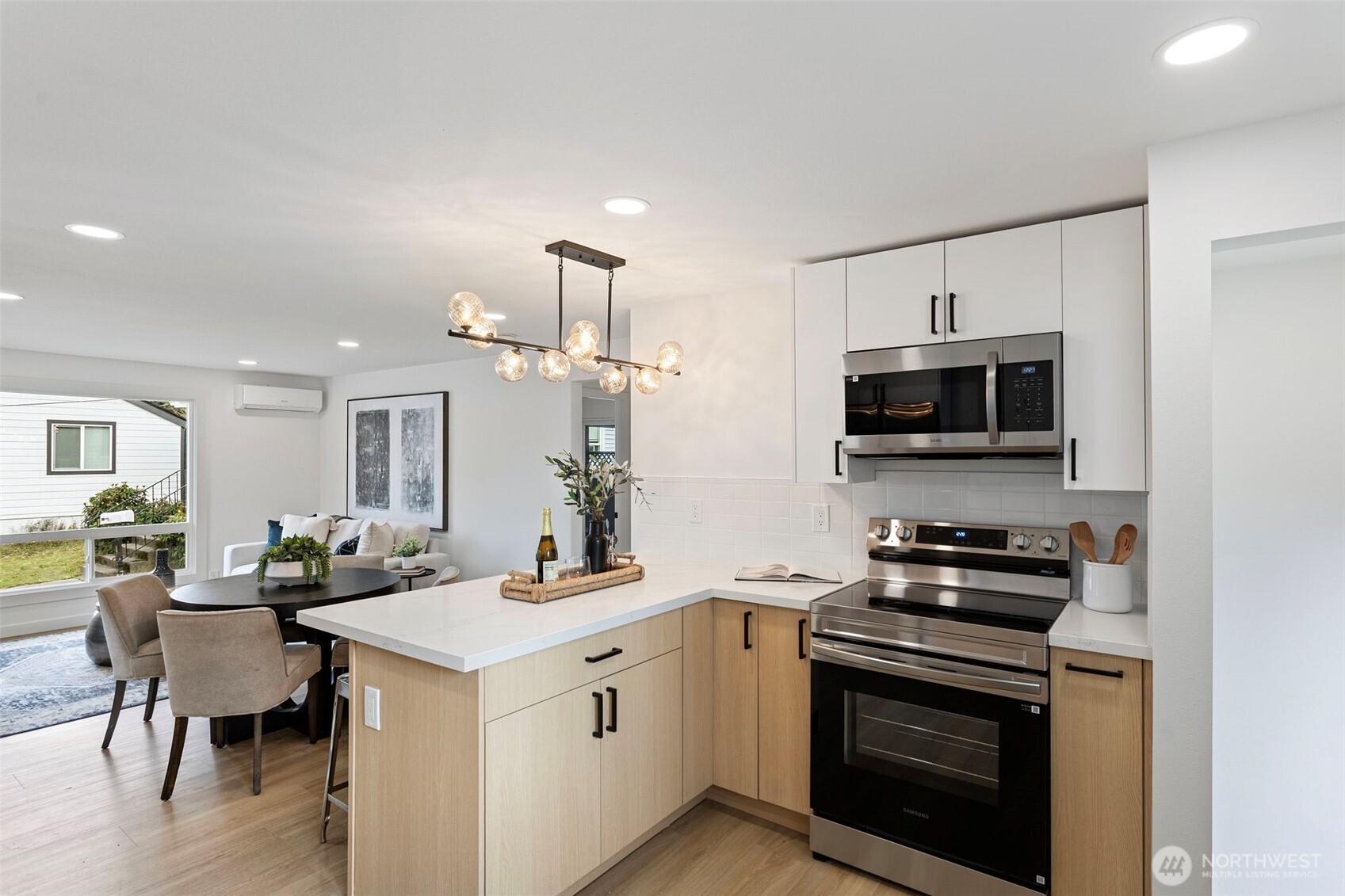 8608 16th Avenue Southwest Seattle, WA 98106 - Photo 10 of 26 a kitchen with a stove and a microwave