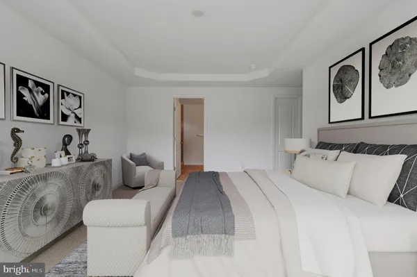 a bedroom with bed and furniture