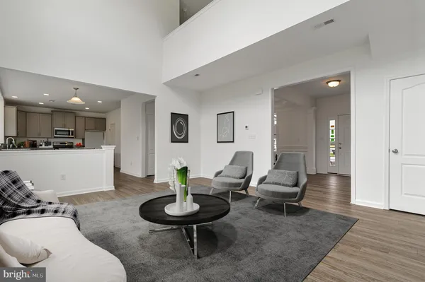 a living room with furniture and a table