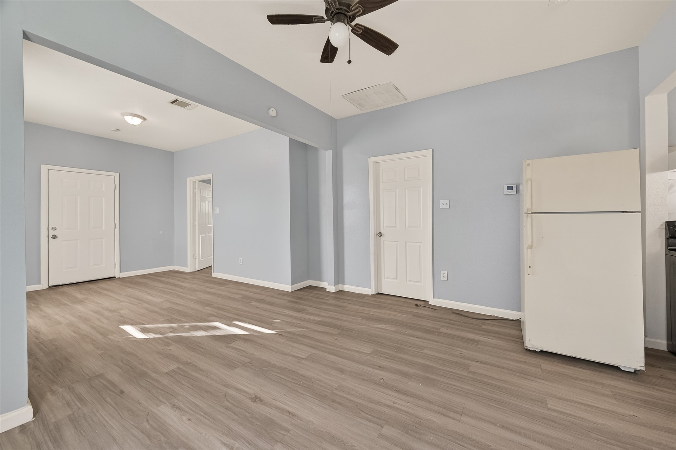 8211 Parnell Street Houston, TX 77051 - Photo 3 of 22 a view of empty room with wooden floor