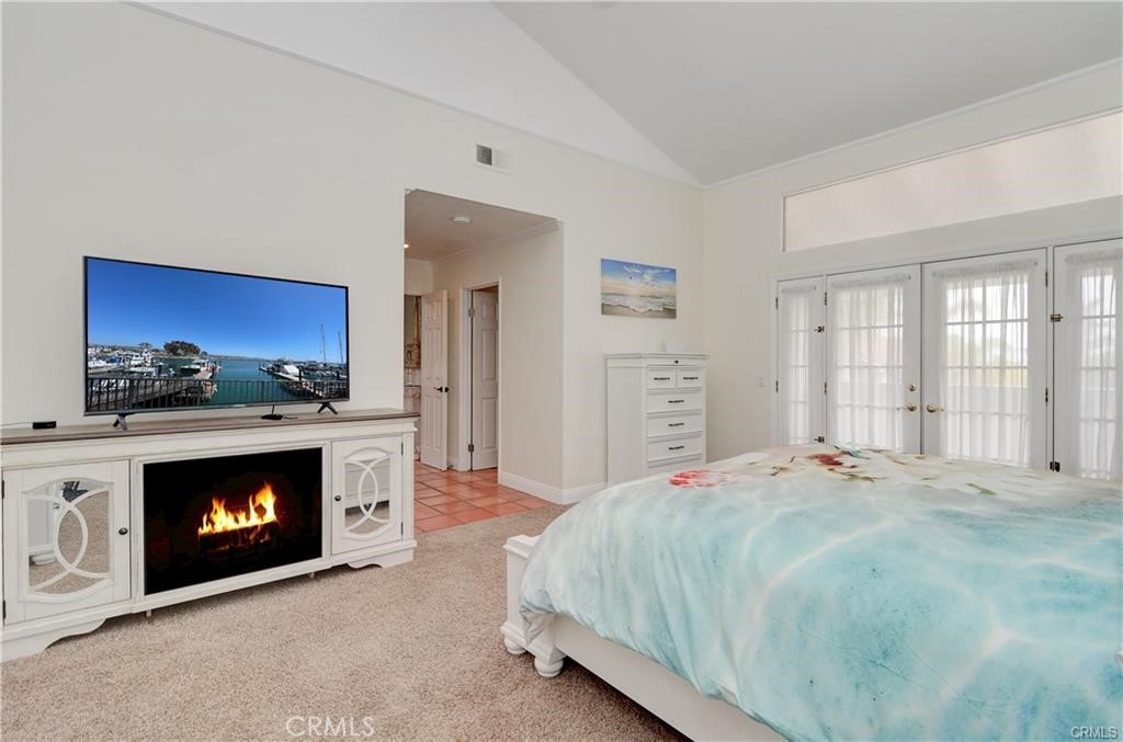 25095 Perch Drive Dana Point, CA 92629 - Photo 17 of 30 a spacious bedroom with a fireplace and a fireplace