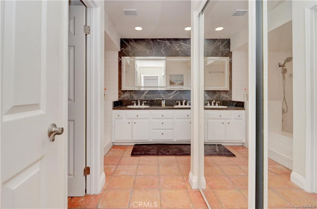 25095 Perch Drive Dana Point, CA 92629 - Photo 18 of 30 a bathroom with a bathtub and a sink