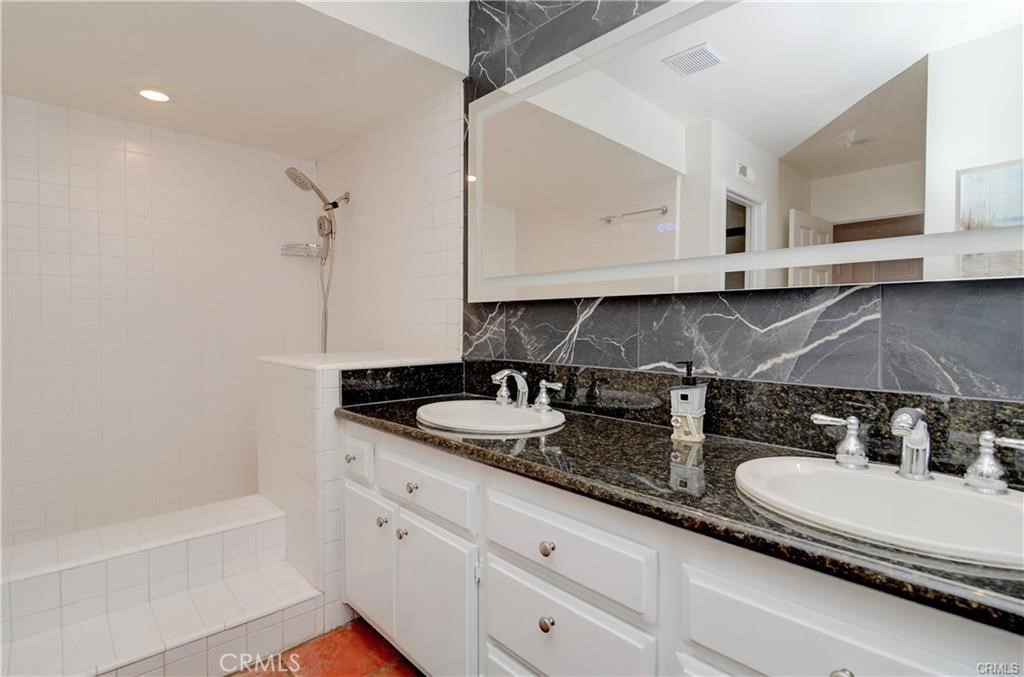 25095 Perch Drive Dana Point, CA 92629 - Photo 19 of 30 a bathroom with sinks and a bathtub