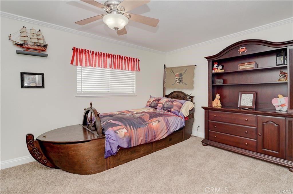 25095 Perch Drive Dana Point, CA 92629 - Photo 21 of 30 a bed room with a bed and a chandelier