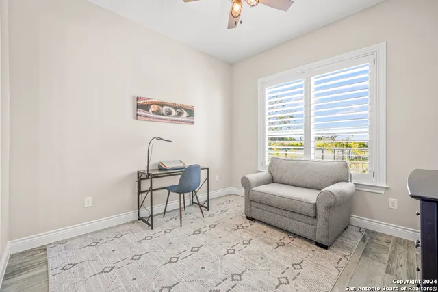 a living room with furniture and a window