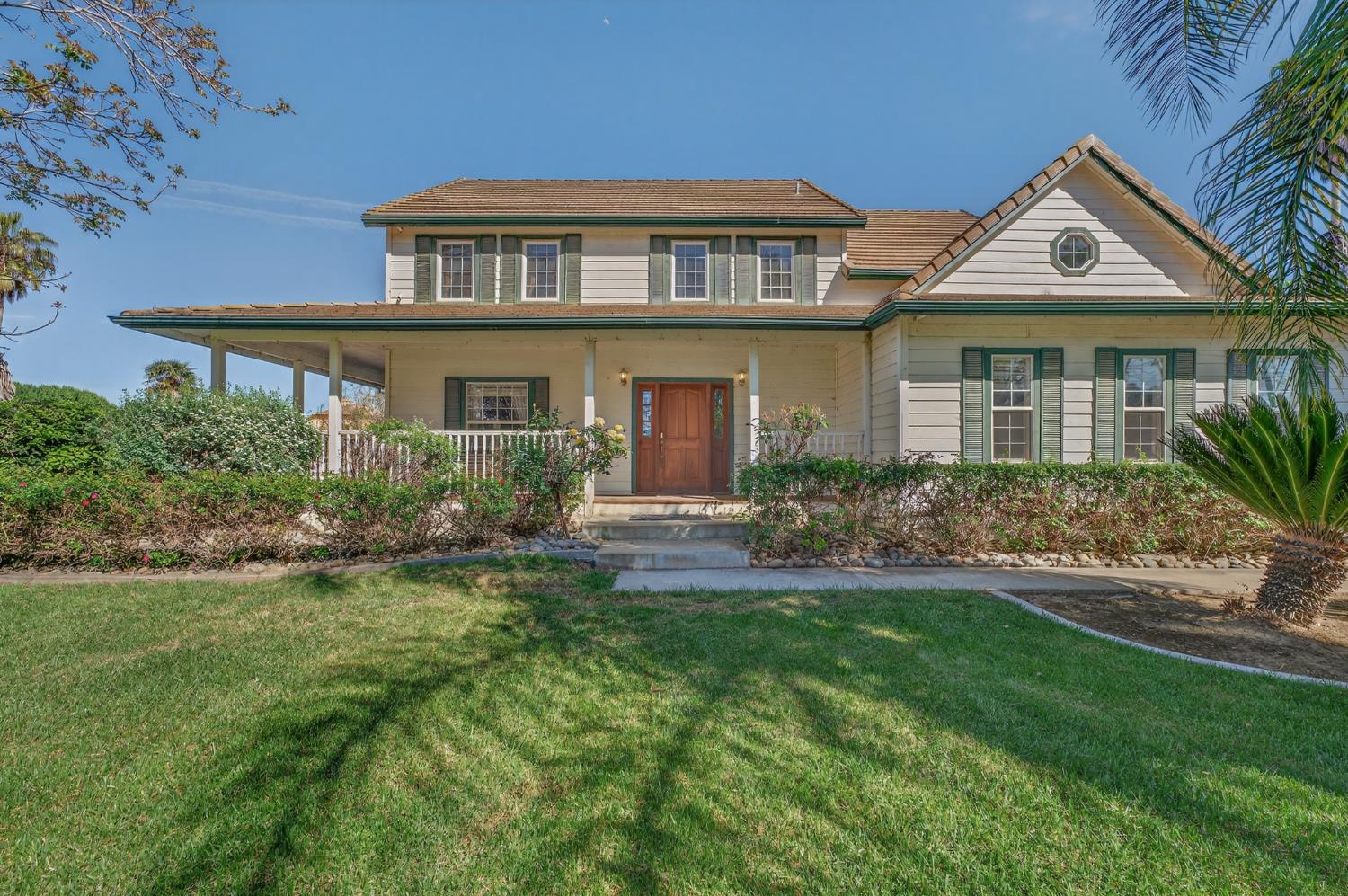 2464 Davis Road Williams, CA 95987 - Photo 1 of 1 a front view of a house with a yard and porch