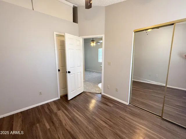 an empty room with wooden floor