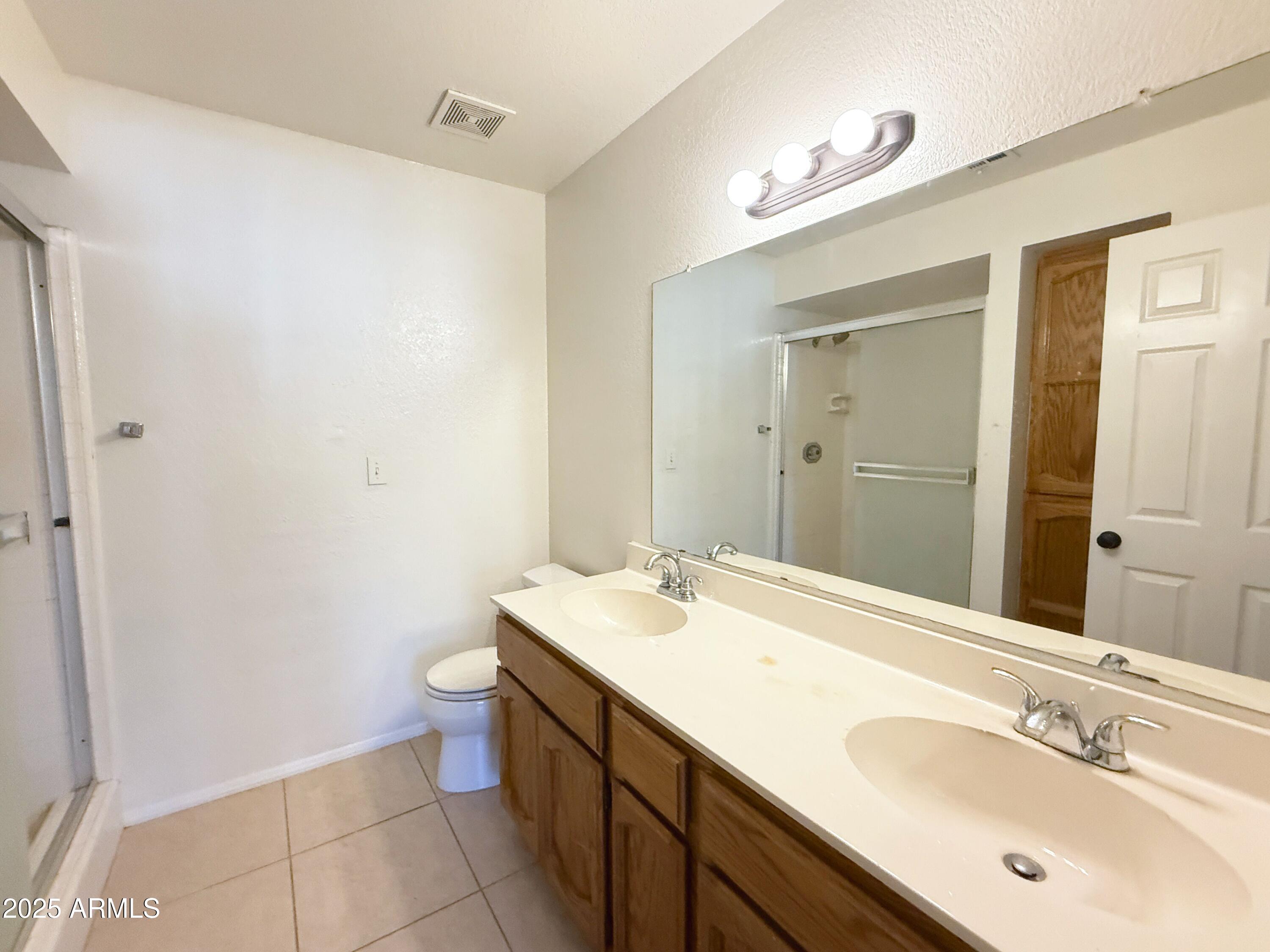 170 East Guadalupe Road, Unit 130 Gilbert, AZ 85234 - Photo 10 of 18 a bathroom with a sink and a mirror