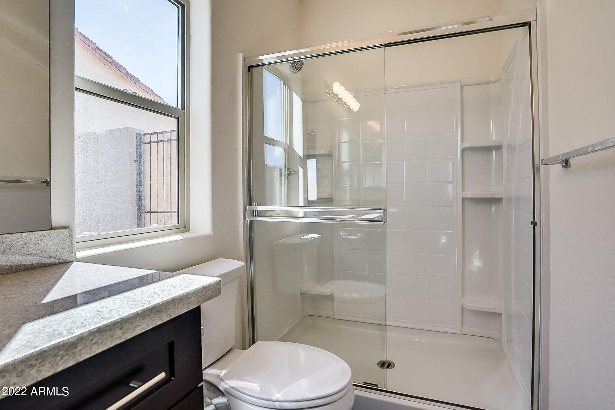 15 Reflection Canyon Drive Page, AZ 86040 - Photo 9 of 16 a bathroom with a granite countertop sink toilet and shower
