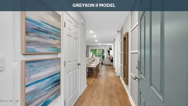 a view of a living room with a wooden floor