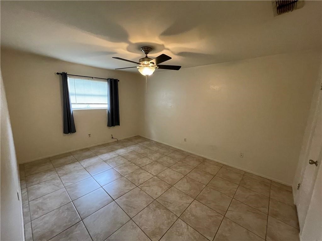 2123 Zephyr Circle Ingleside, TX 78362 - Photo 13 of 29 an empty room with windows and fan