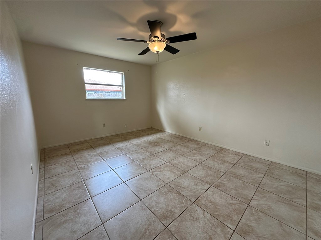 2123 Zephyr Circle Ingleside, TX 78362 - Photo 16 of 29 a view of an empty room with a ceiling fan