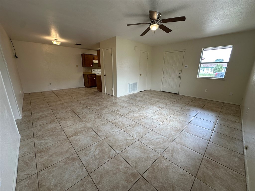 2123 Zephyr Circle Ingleside, TX 78362 - Photo 2 of 29 an empty room with a empty space and windows