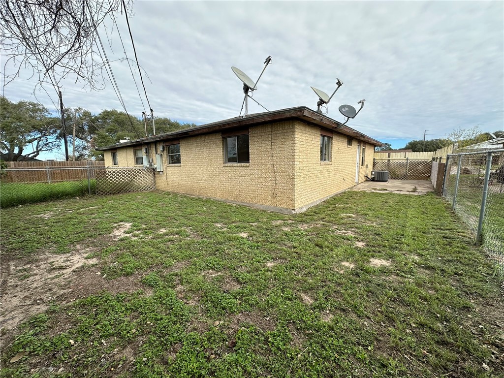 2123 Zephyr Circle Ingleside, TX 78362 - Photo 29 of 29 a white house that has a small yard and a large tree