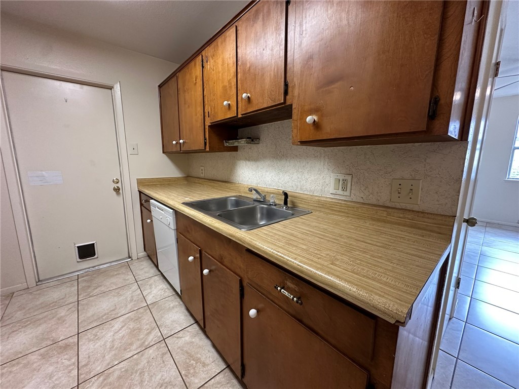 2123 Zephyr Circle Ingleside, TX 78362 - Photo 7 of 29 a kitchen with stainless steel appliances granite countertop a sink stove and cabinets