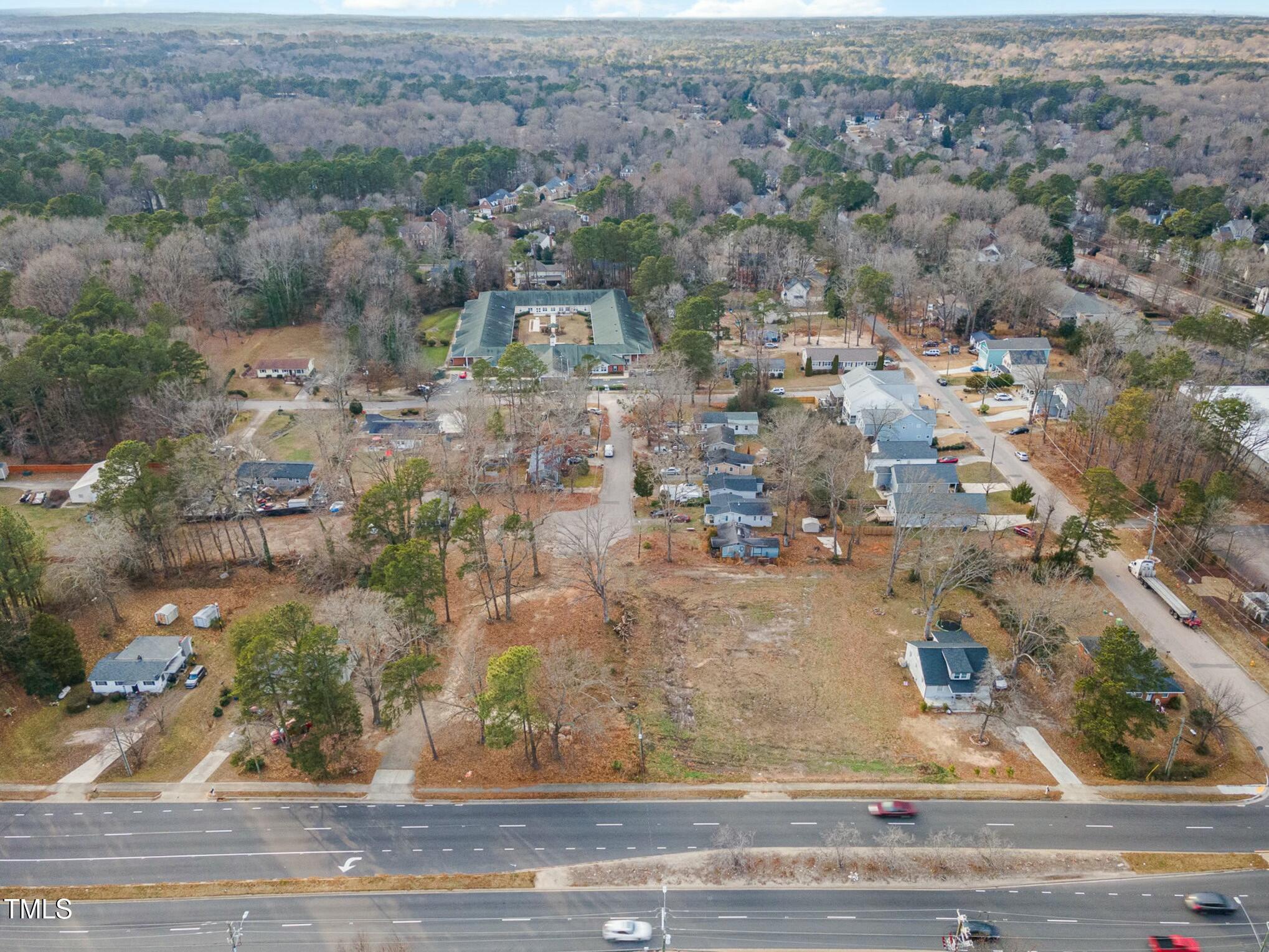 6217 Creedmoor Road Raleigh, NC 27612 - Photo 3 of 7 an aerial view of residential houses with outdoor space