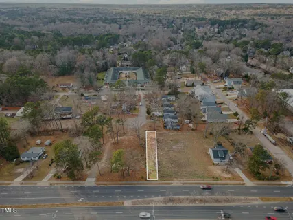 an aerial view of house with yard