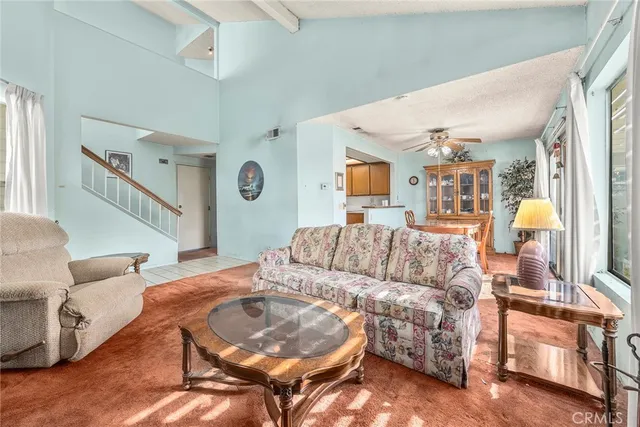 a living room with furniture and a table